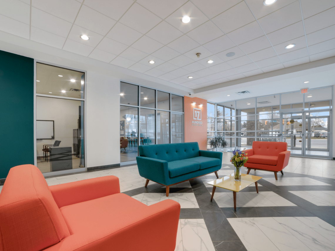 Lobby with blue and orange couches
