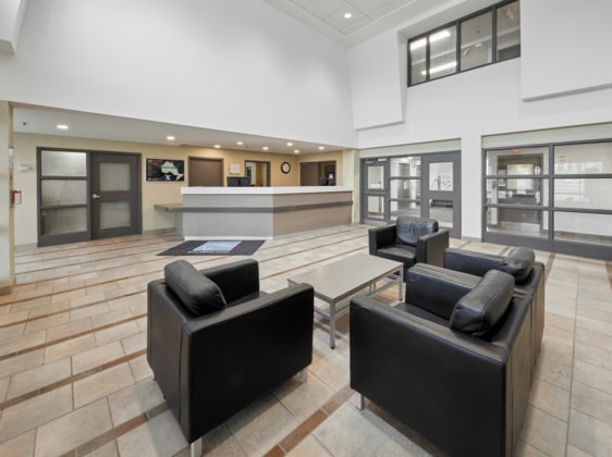 lobby with front desk lounge chairs and coffee table