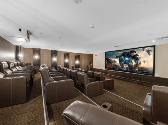 Movie theatre with big screen tv and stadium seating