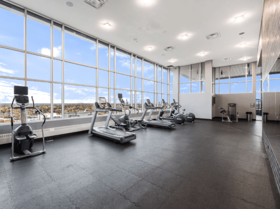 fitness centre with gym equipment and large windows