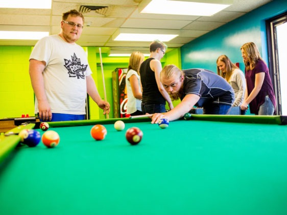 games room with students playing pool