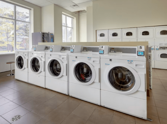 laundry room with multiple laundry machiens